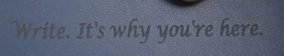 An image of Morrie's deskmat text: Write. It's why you're here.